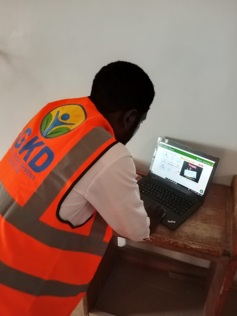 GKD-YDI team member deploying CBT examination software on a laptop
